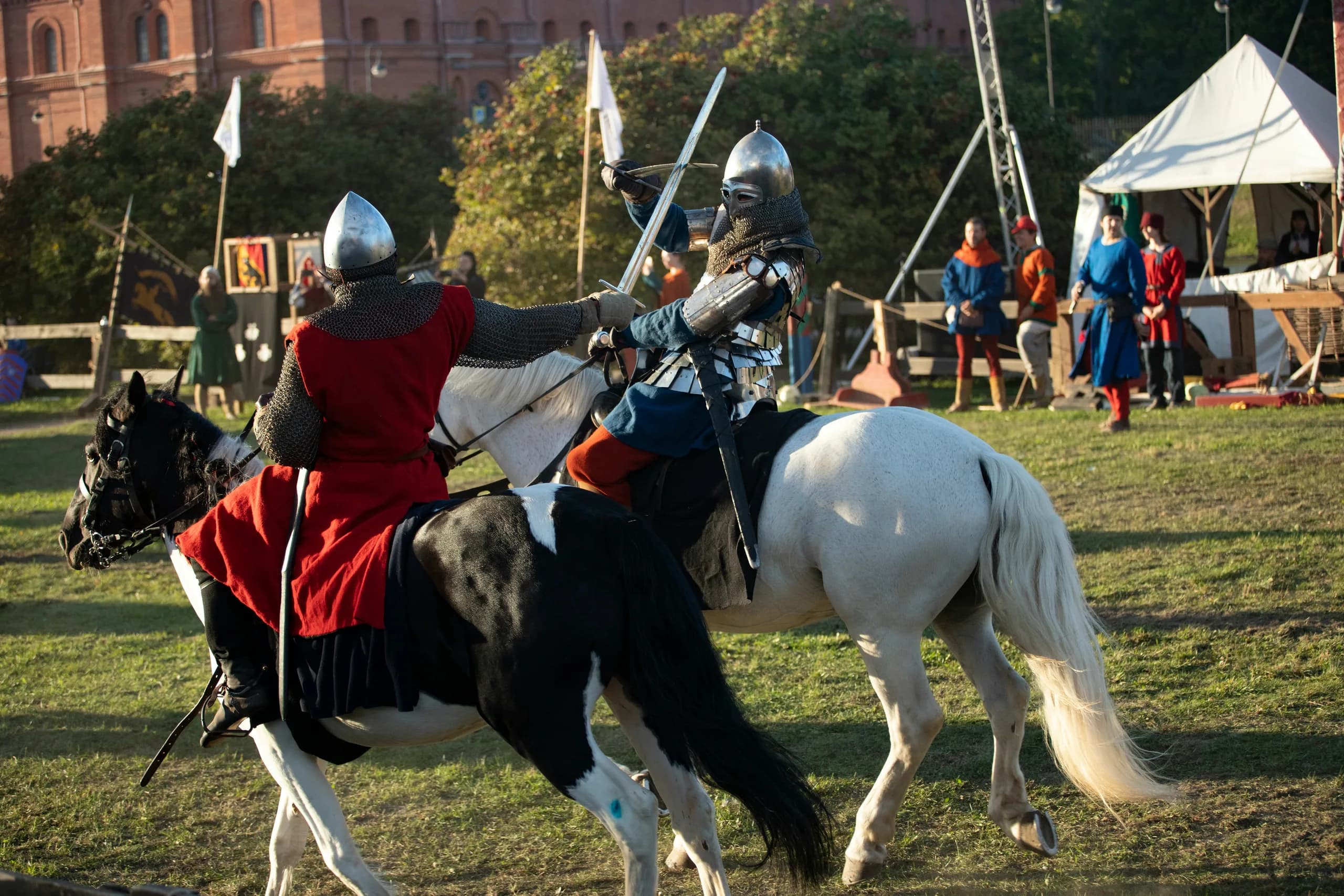 Armoured knights jousting at the tournament