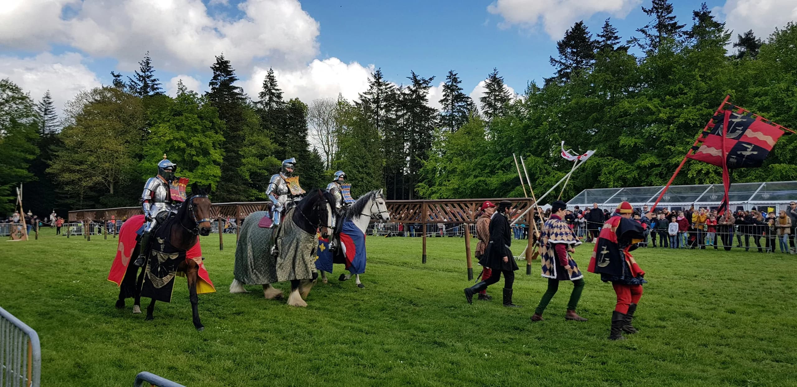 Armoured knights jousting at the tournament